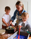 Mom and her 2 little boys seen using the GIR 8 Piece Mini Bundle whilst baking. 